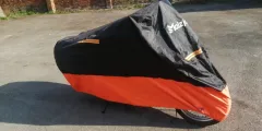 Bike is stored in the building but also comes with weather protection cover