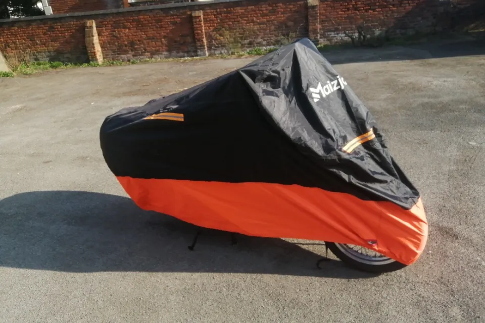 Bike is stored in the building but also comes with weather protection cover